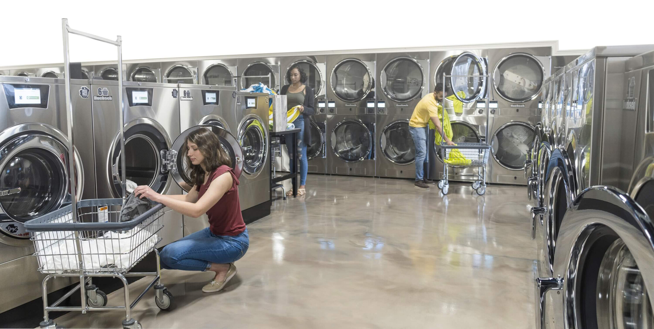 interior of Huebsch laundromat with guests doing laundry